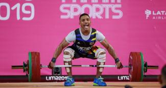 Venezuelan Julio Mayora competes in the men’s 73 kg weightlifting event at the Chorrillos Military School at Lima 2019.	