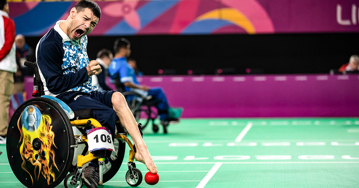 Argentinian Para athlete Mauricio Ibarbure with the ball during the boccia competition at Lima 2019.