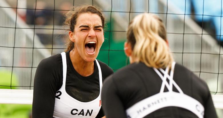 Canadian players Lapointe and Harnett celebrate point against Guatemala