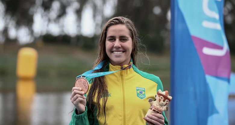 Viviane Eichelberg from Brazil posing with her bronze medal after the 10 km open water final held at Laguna Bujama