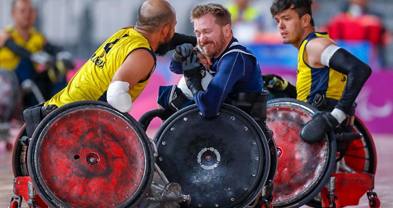 American Lee Fredette and Colombian John Orozco fight for the ball in the Lima 2019 wheelchair rugby match at the Villa El Salvador Sports Center