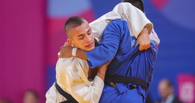 Colombian judoka Jorge Gonzales goes up against Peruvian Juan Postigos in the Lima 2019 men’s -66 kg competition at the National Sports Village – VIDENA