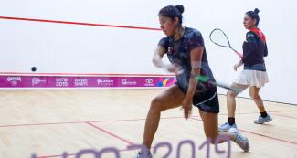 Diana Garcia from Peru and Ximena Rodriguez from Mexico go face to face in squash competition