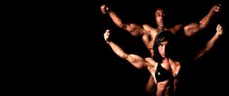 A couple of bodybuilders perform a pose for the camera. 