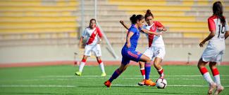 Female teams from Peru and Colombia face off in a match prior to Lima 2019.