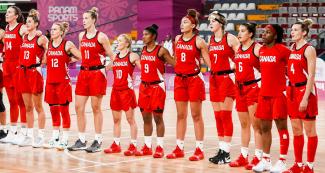 The Canadian women’s basketball team singing their national anthem before the Lima 2019 basketball match against Paraguay at the Eduardo Dibós Coliseum