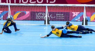 Ana Custodia, Ana Assuncao and Victoria Nacimiento from Brazil look for the ball during the goalball match against Canada at the Callao Regional Sports Village at Lima 2019.