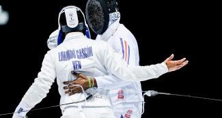 Venezuelan Rubén Limargo greets his opponent, Cuban Yunior Reytor, in the men's fencing semifinals