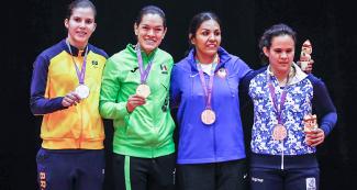 Mexican Lenia Ruvalcaba (gold), Alana Martins from Brazil (silver), and Christella Garcia from USA and Argentinian Nadia Boggiano (bronze) posing with their judo medals at the National Sports Village – VIDENA, Lima 2019.