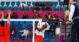 Peruvian volleyball team player Paul Williams faces Cuban Marlon Yang at the Callao Regional Sports Village during the Lima 2019 Games.