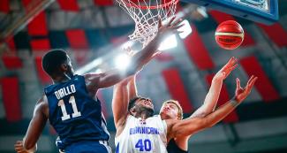 Luis Santos from Dominican Republic fights for control of the ball against Alpha Diallo from United States in the Lima 2019 basketball game at Eduardo Dibós Coliseum