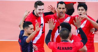 Peruvian volleyball team players gather during the Lima 2019 match against Cuba at the Callao Regional Sports Village.