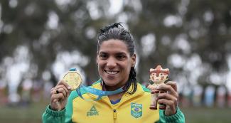 Ana Marcela Soares from Brazil posing with her gold medal after the 10 km Open Water Final held at Laguna Bujama