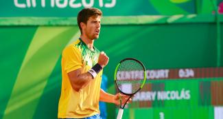 The Brazilian Joao Menezes competing against Chile in the Lima 2019 men’s tennis competition at the Lawn Tennis Club