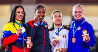 Omaira Molina from Venezuela, Pamela Rodriguez from the Dominican Republic, Isabel Aco from Peru and Cirrus Lingl from the US show the medals they won in women’s karate at the Lima 2019 Games.