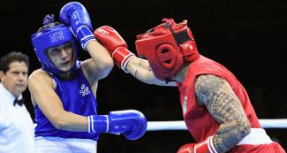 razilian boxer Beatriz Soares tries to attack Dayana Sanchez from Argentina, but she defends herself in the Lima 2019 women’s final held at the Callao Regional Sports Village