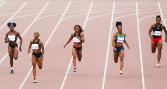 Athletes from Ecuador, Bahamas, Canada, Jamaica, Brazil, and Trinidad and Tobago running during the Lima 2019 women’s 200m athletics event at the National Sports Village (VIDENA)