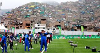 Athletes from the Americas competing in the men’s team recurved bow quarterfinals at Villa María del Triunfo Sports Center in the Lima 2019 Games