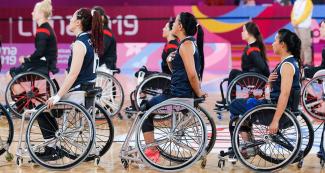 Colombian wheelchair basketball team singing national anthem before the match against Canada at the National Sports Village – VIDENA, Lima 2019