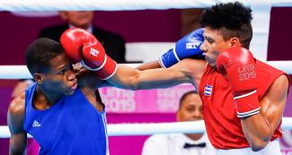Cuban Yosbany Veitía and Dominican Rodrigo Marte face off in the ring in the men’s flyweight class of the Lima 2019 Pan American Games at the Callao Regional Sports Village.