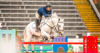 Guatemalan Juan Pablo Pivaral riding his horse during equestrian individual jumping training session at the Army Equestrian School