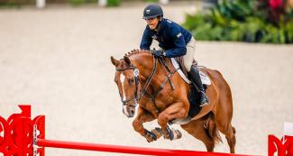 Héctor Florentino riding his horse during equestrian individual jumping training session at the Army Equestrian School