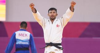 Peruvian judoka Alonso Wong celebrates his victory against Mexican Eduardo Araujo in the Lima 2019 men’s -73 kg competition at the National Sports Village – VIDENA