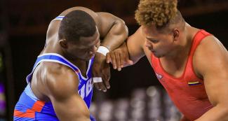 Tough Greco-Roman wrestling competition between Cuba’s Mijain Lopez and Venezuela’s Moises Perez at the Lima 2019 Games at the Callao Regional Sports Village