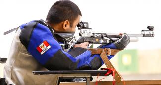 Jorge Arcela from Peru aiming his rifle during the mixed 25 m sport pistol SH1 final, at Las Palmas Air Base, at Lima 2019