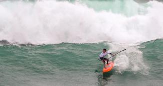 Peruvian Vania Torres in women’s SUP surfing competition at the Lima 2019 Games in Punta Rocas. 