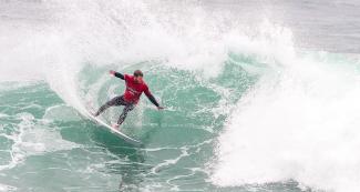 Leandro Usuna from Argentina showing his skills on the waves in the men’s open surfing competition in Punta Rocas