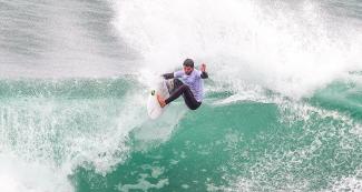 Argentina’s Santiago Muñiz riding the waves in the men’s open surfing competition in Punta Rocas