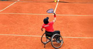 Maria Castillo prepares to hit the ball in the wheelchair tennis match against Chile held at the Lawn Tennis Club