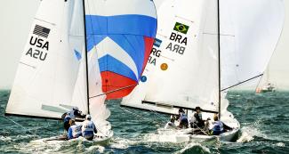 The USA and Brazil competing in three-person dinghy at the Paracas Bay, at Lima 2019