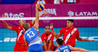 Puerto Rican volleyball player Seguiel Sanchez jumps to hit the ball during a match against Peru played at Callao Regional Sports Village at the Lima 2019 Games.
