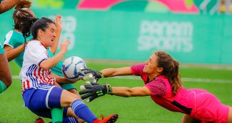 Sydney Schneider from Jamaica saves a shot by Fanny Godoy from Paraguay during the first round of women's football Group A at Lima 2019, at San Marcos Stadium