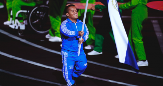 Salvadoran Para athlete Herbert Aceituno proudly walks with his country’s flag at the Lima 2019 Parapan American Games Opening Ceremony at the National Stadium.
