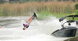 Regina Jaquess from the United States slides across the water during the Lima 2019 water ski competition at Laguna Bujama.