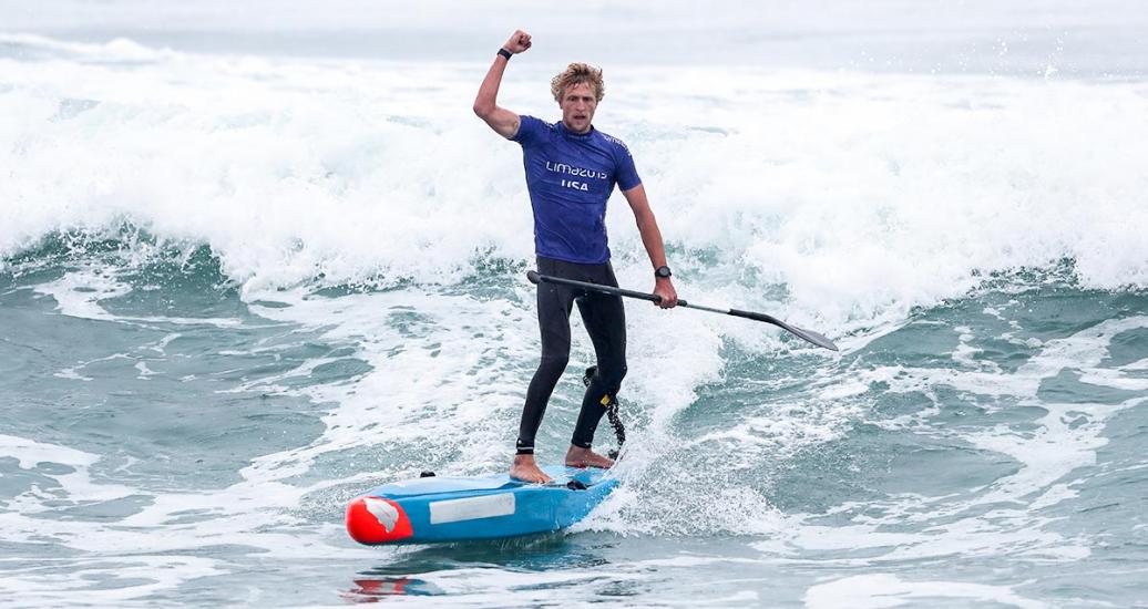 American surfer Connor Baxter celebrates after winning gold in men’s SUP surfing in Punta Rocas