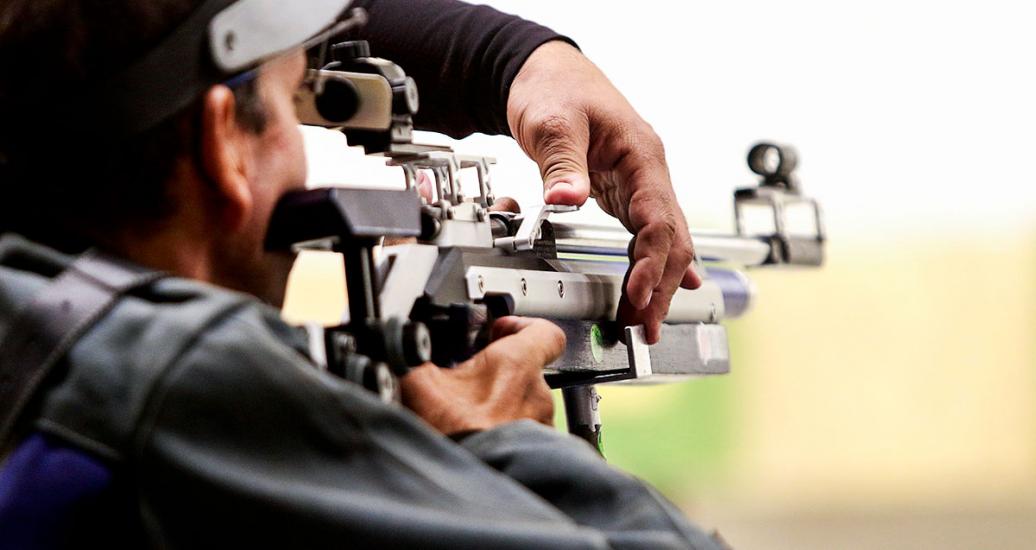 Venezuelan Humberto Linarez takes aim with his rifle in the shooting Para sport 10m air rifle prone SH2 competition at Las Palmas Air Base, at Lima 2019