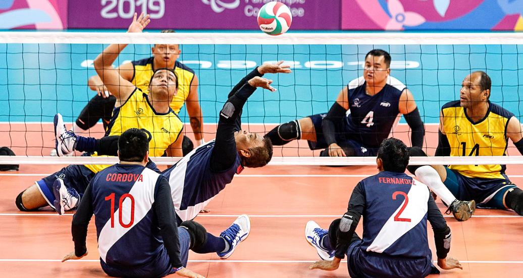 Peruvian player fights for the ball in Lima 2019 sitting volleyball against Colombia at the Callao Regional Sports Village