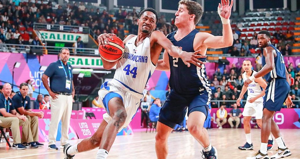 Luis Montero from Dominican Republic controls the ball in the Lima 2019 basketball game against the United States at the Eduardo Dibós Coliseum