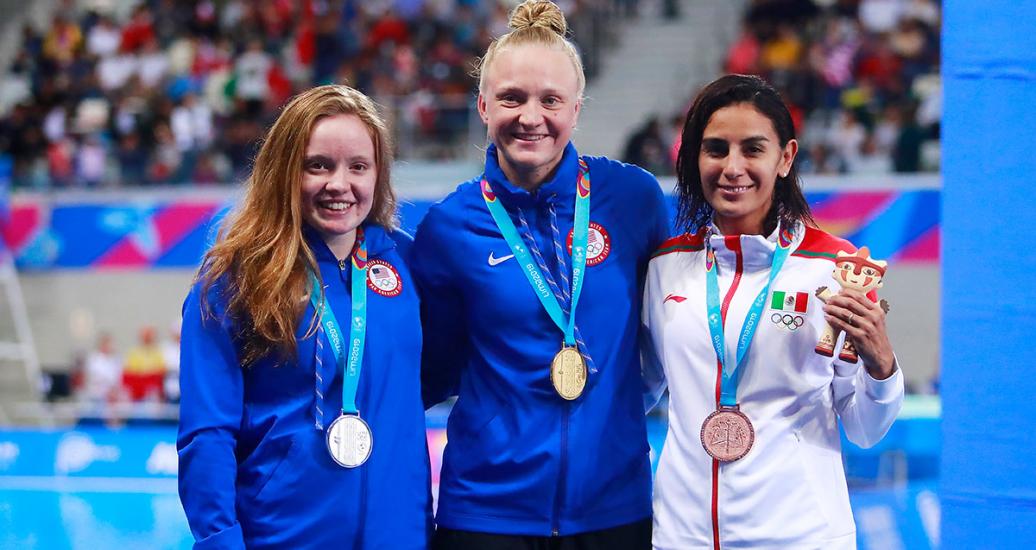 American Brooke Schultz (silver), Sarah Bacon (gold) and Mexican Paola Espinosa (bronze) look happy with their presents after competing in diving events at the Lima 2019 Games.  