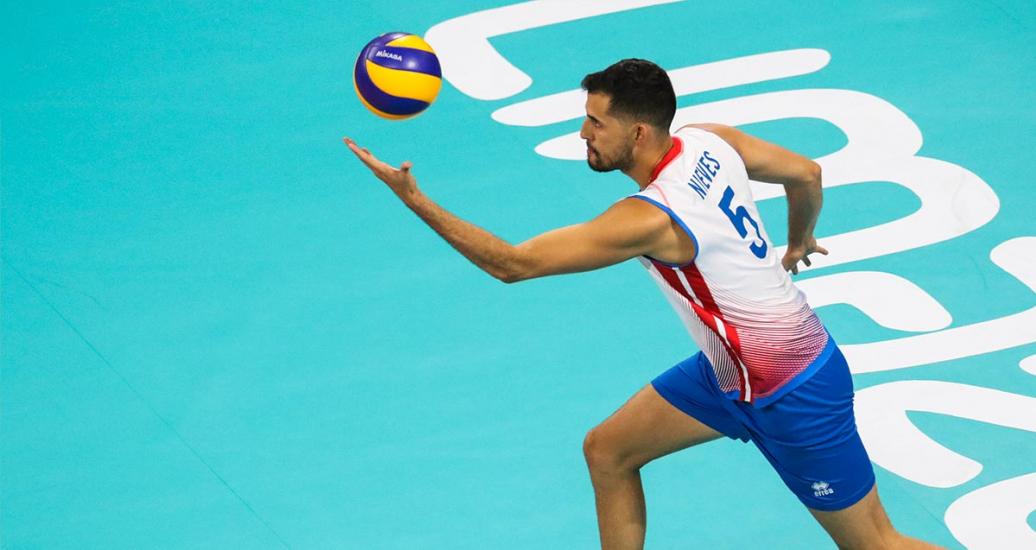 Pedro Nieves from Puerto Rico competes against Argentinian volleyball team at the Callao Regional Sports Village during the Lima 2019 Games.