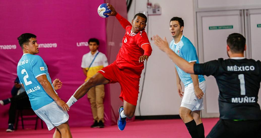 Jorge Nazario from Puerto Rico competes against Luis Avalos and Francisco Muñiz in the handball match held at the National Sports Village – VIDENA at the Lima 2019 Games