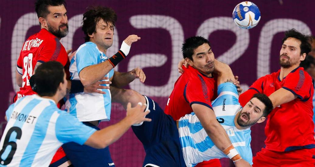 Argentina’s Federico Pizarro and Chile’s Javier Frelijj during the handball final held at the VIDENA, at the Lima2019 Pan American Games.