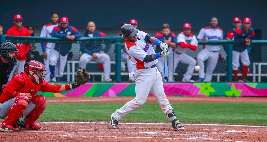 Yunior Ibarra from Cuba faces off Eduardo de Oleo from the Dominican Republic at the Lima 2019 baseball game held at the Villa María Sports Center