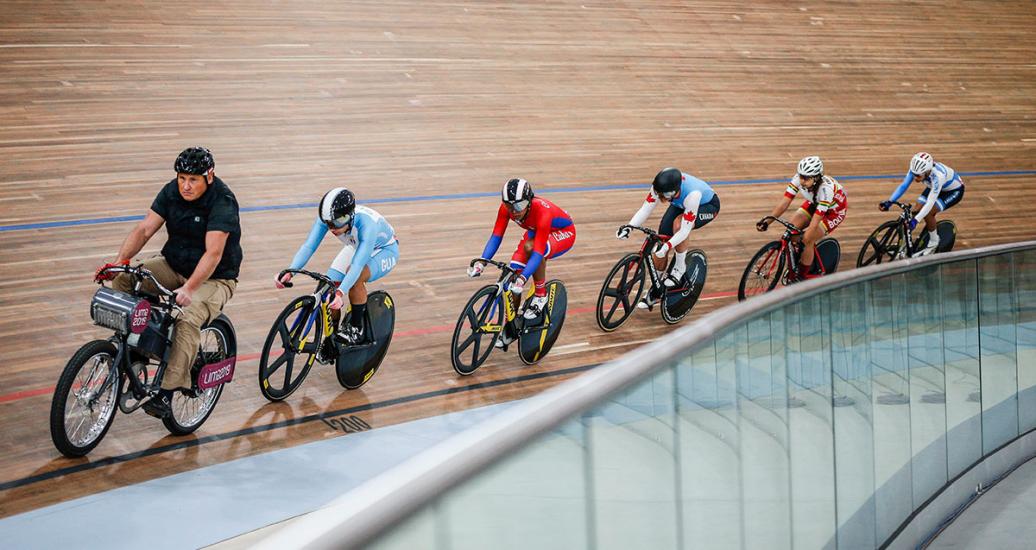 Female cyclists Joanne Rodríguez, Lisandra Guerra, Marie Mitchell, Micaela Sarabia, and Andrea Vera compete at speed along the circuit at the Lima 2019 Games