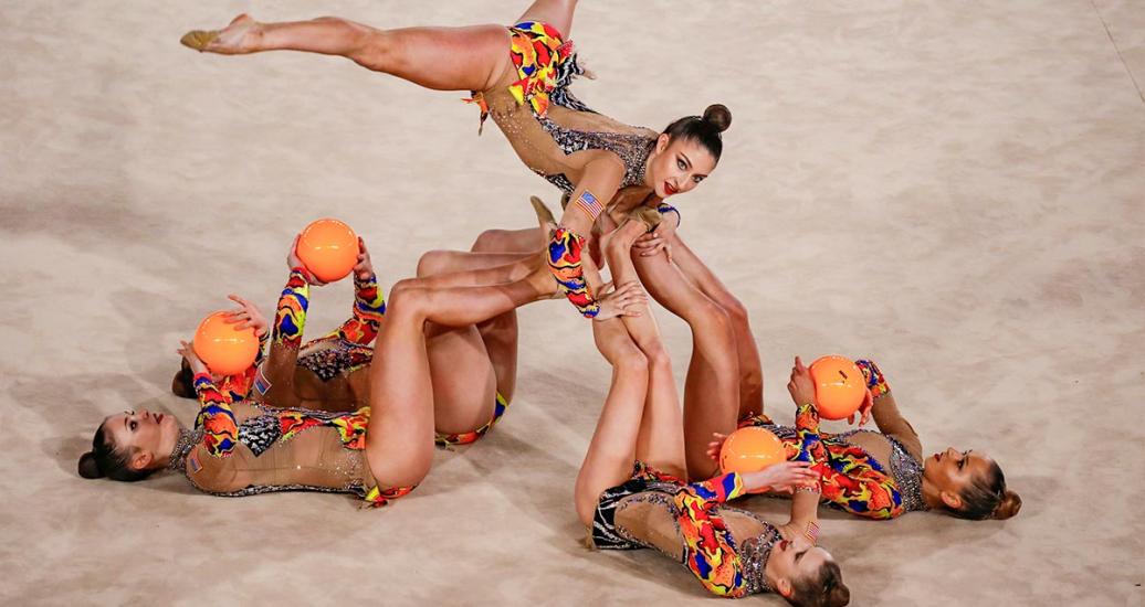 American gymnasts performing their routine with five balls in Lima 2019 rhythmic gymnastics final event at Villa El Salvador Sports Center