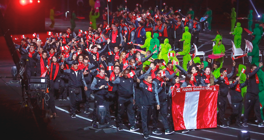 Peruvian delegation walks in carrying the national flag at the Lima 2019 Parapan American Games Opening Ceremony at the National Stadium.